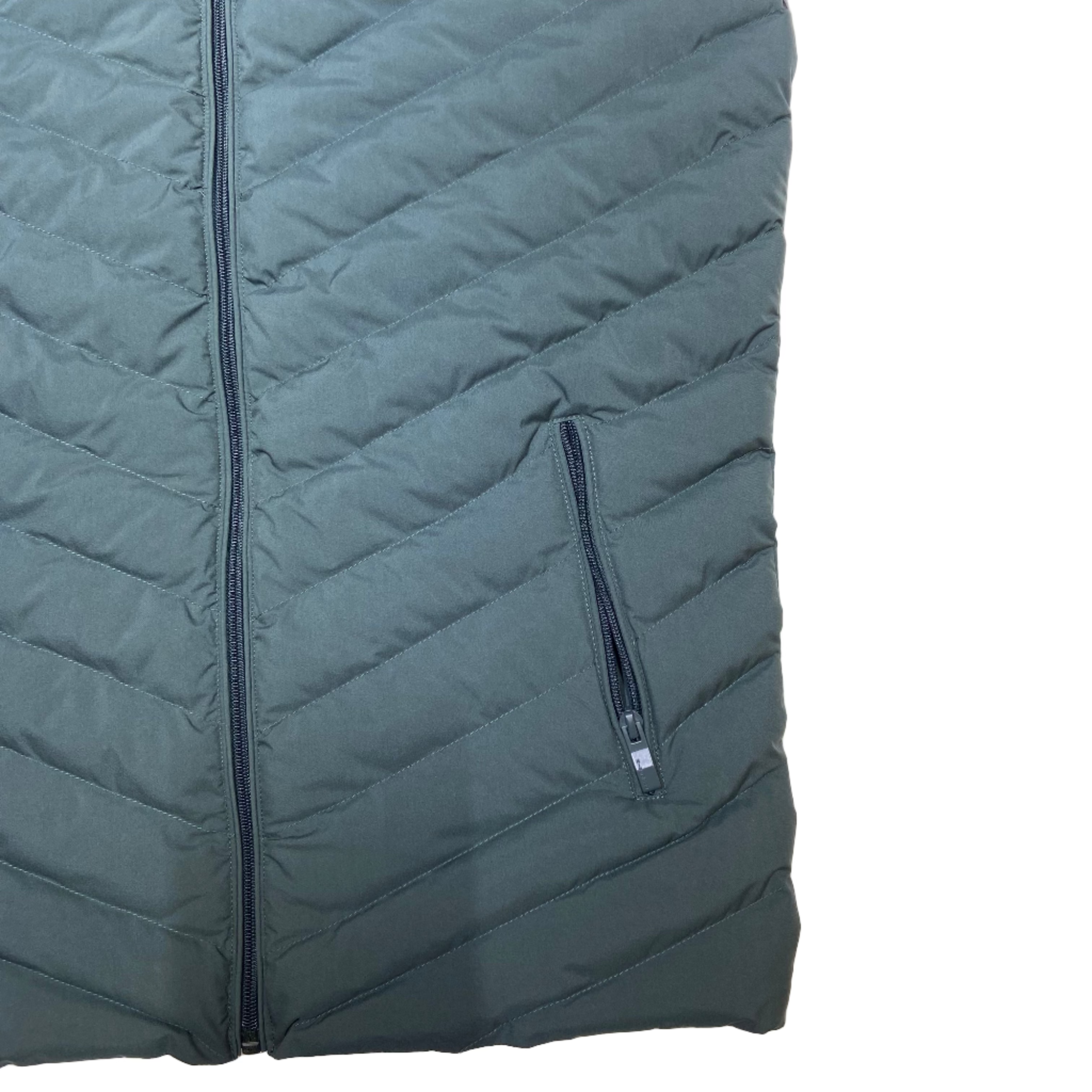 Quilted jacket with a main and pocket zipper with details on a white background