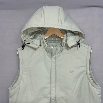 Light gray vest with hood on a hanger against a gray background